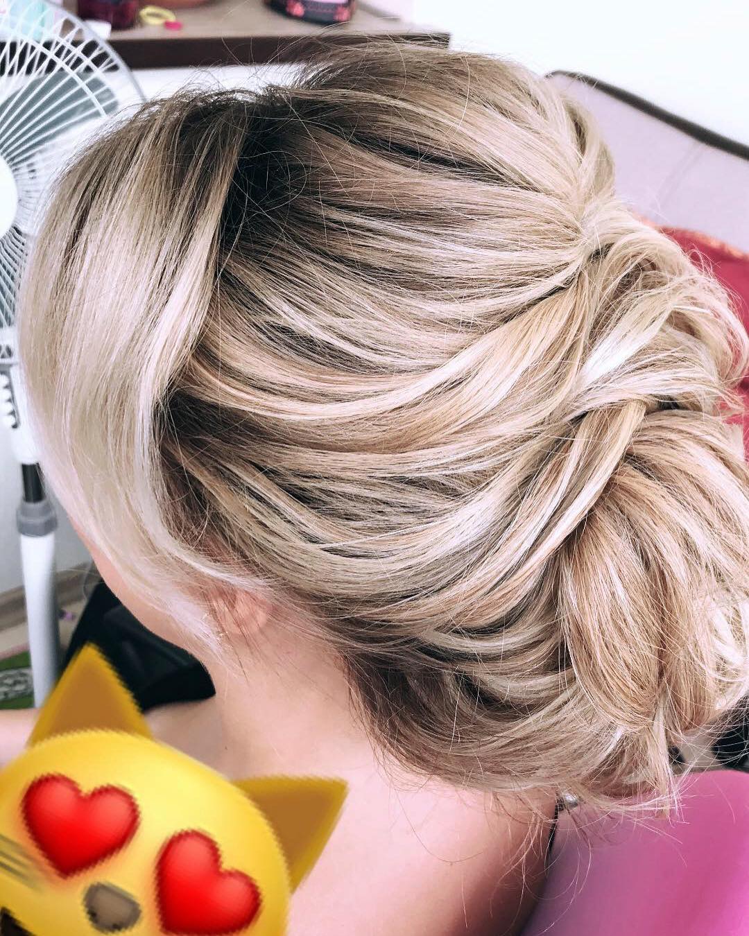 A textured low bun is an elegant and comfortable hairstyle, which is why so many girls (brides and beyond?) love it! #lowbun #texturedbun #weddinghairstyle #weddinghair #stylistsinKyiv #makeupartistsinKyiv #hairstylingtraining in Sand Diego, CA